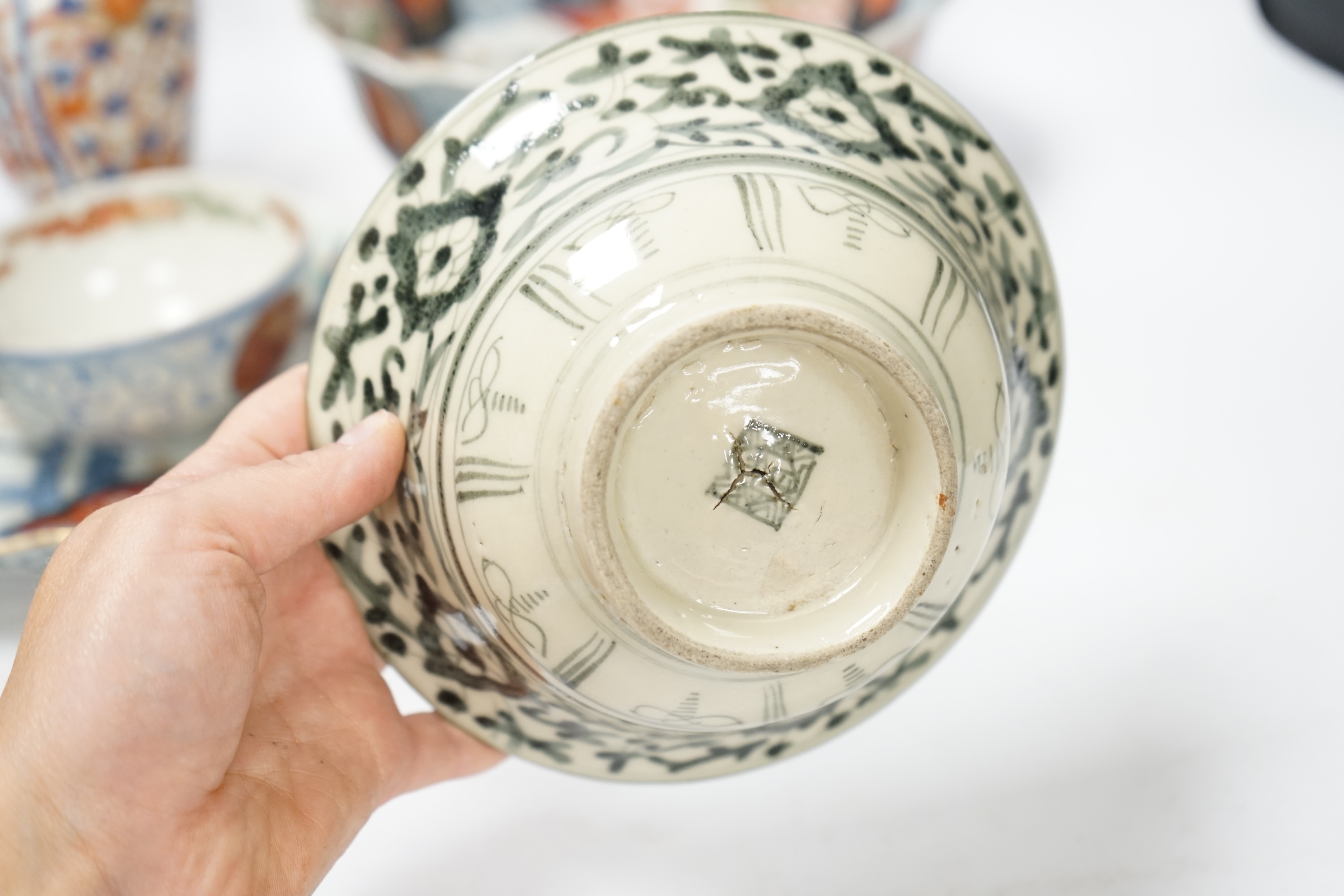 Japanese ceramics to include an Imari vase and bowl and a blue and white dish, 22cm diameter. Condition - two bowls and dish good, others poor